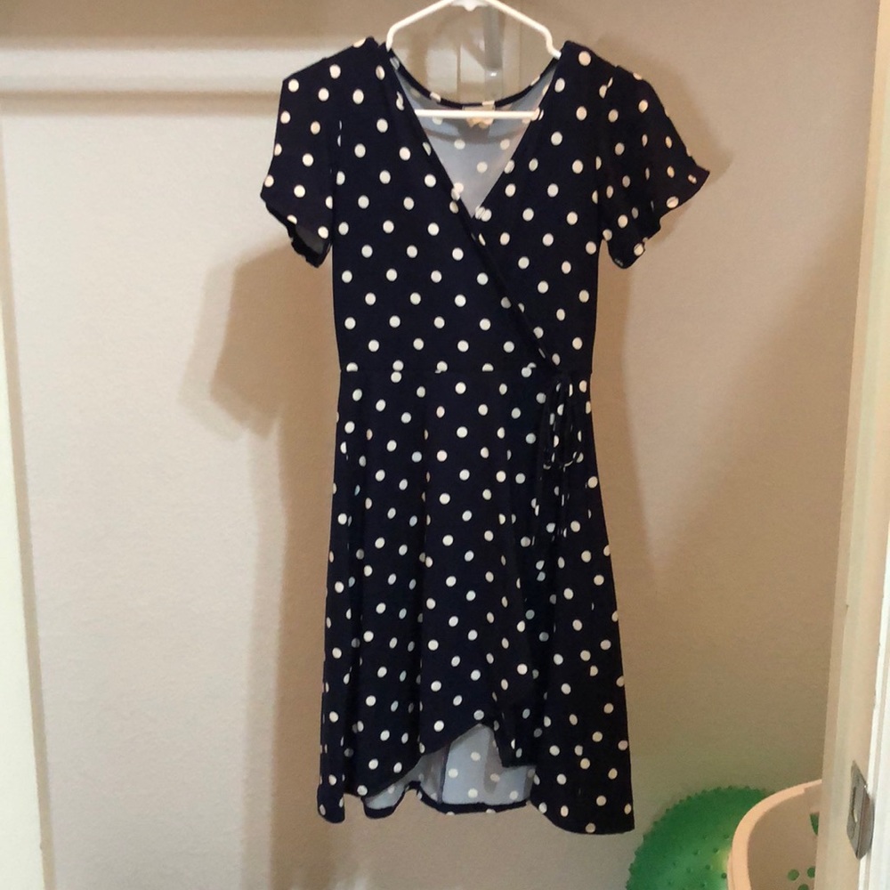 a polk-a-dot dress with a side tie